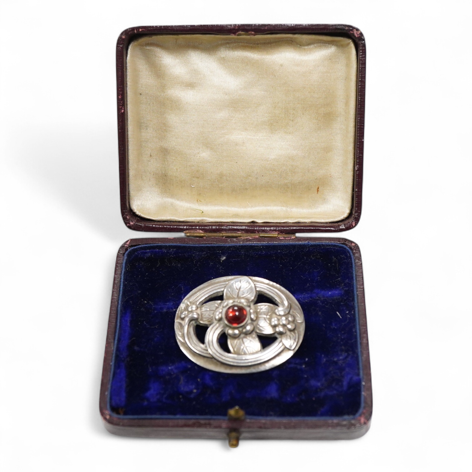 A Georg Jensen 925S and single stone cabochon garnet set oval brooch, design no. 138, 38mm.